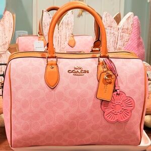 Coach Powder Pink and Tan ROWAN (‘LARGE) signature satchel bag.